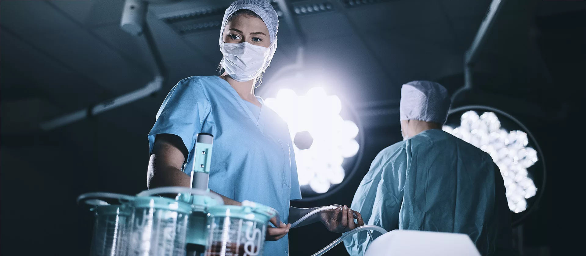 Nurse in the OR using Serres Suction bags.